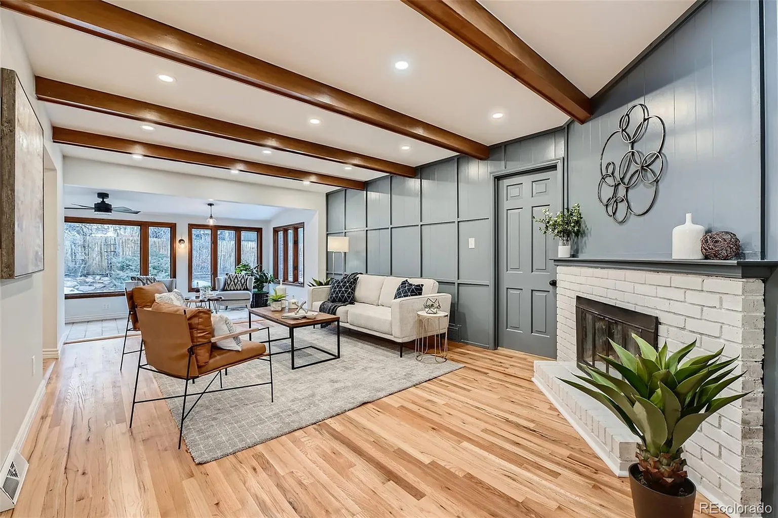 Living room renovation with accent wall and fireplace transformation